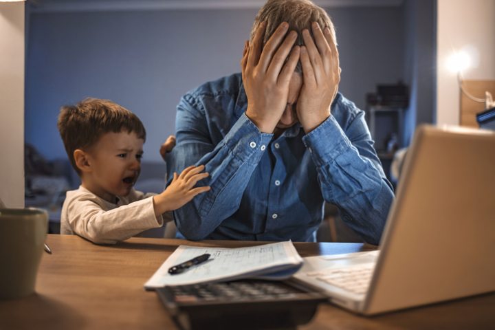 Working parent with crying son